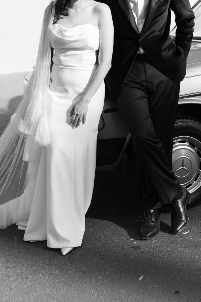 Stylish couple portraits with a classic vintage car.