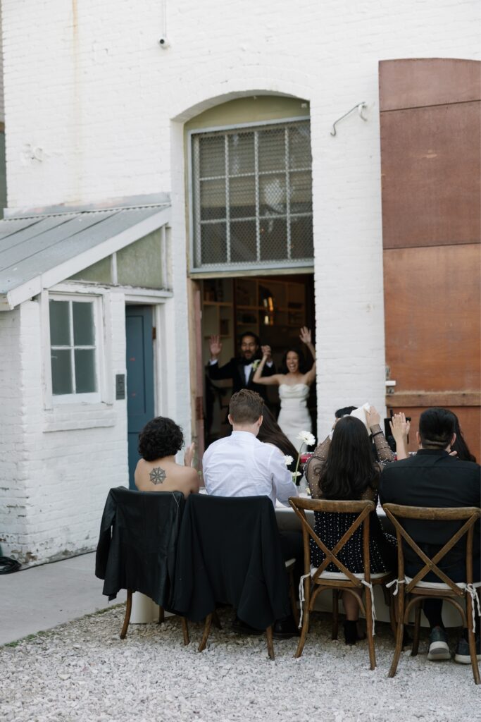 Bride and groom making their reception entrance.
