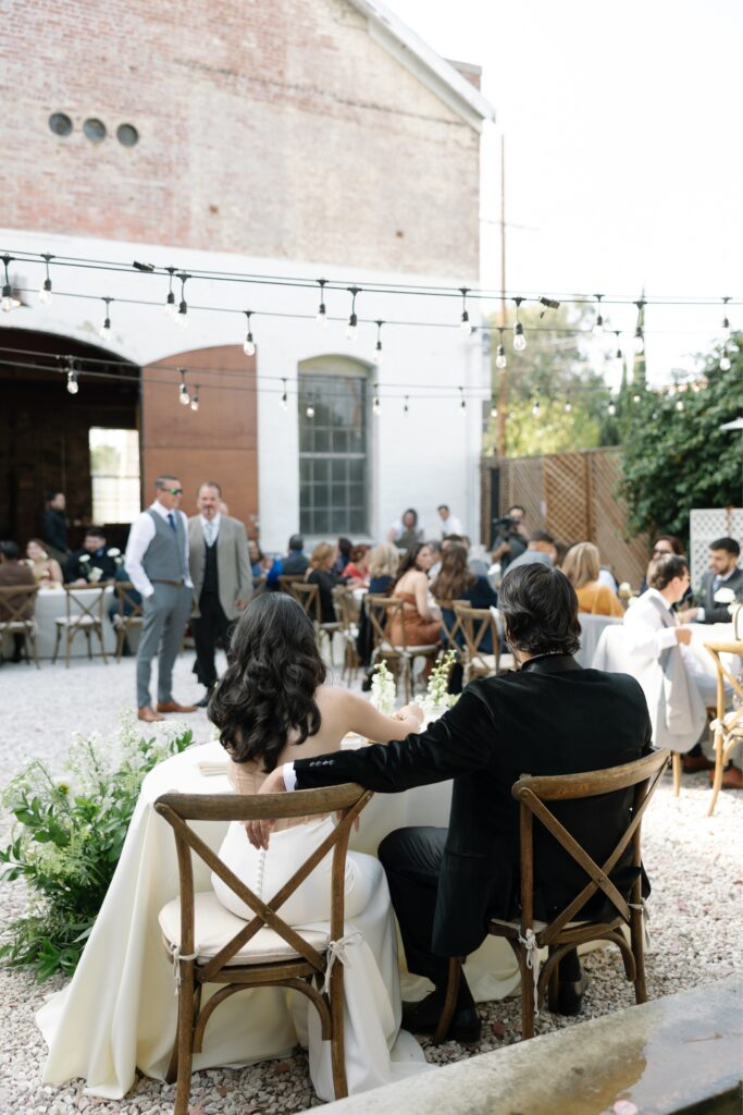 Intimate wedding reception with industrial venue charm.