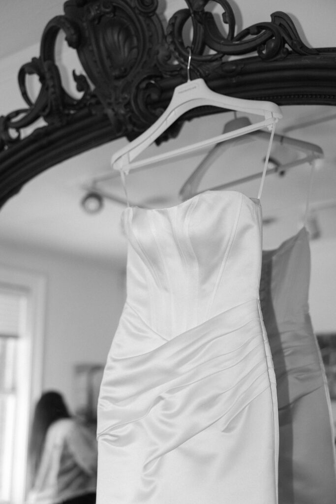 Bride's wedding dress hanging before the ceremony.