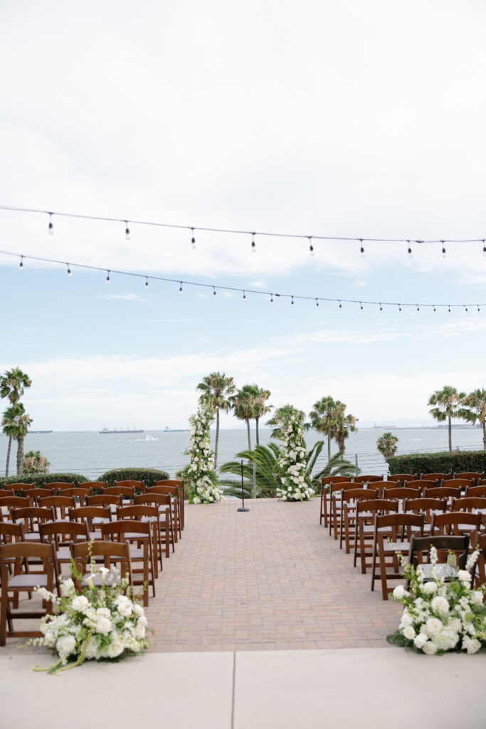Wedding ceremony with Long Beach in the background.