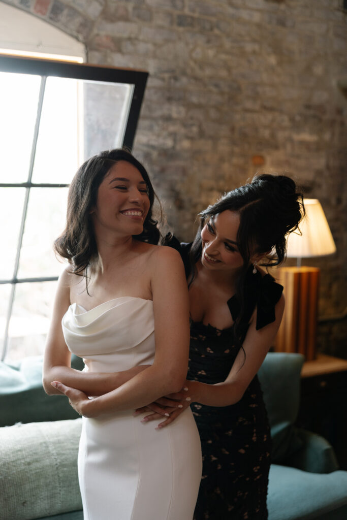 Bride getting ready in a vintage gown before her wedding.