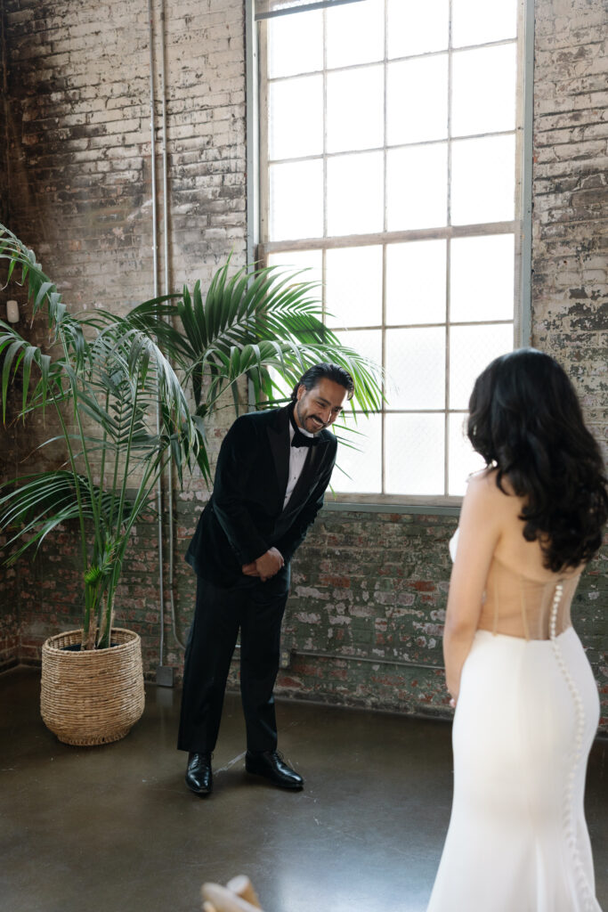 Bride and groom sharing an emotional first look before their wedding.