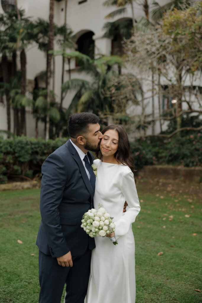 Bride and groom sharing a quiet moment before saying "I do."
