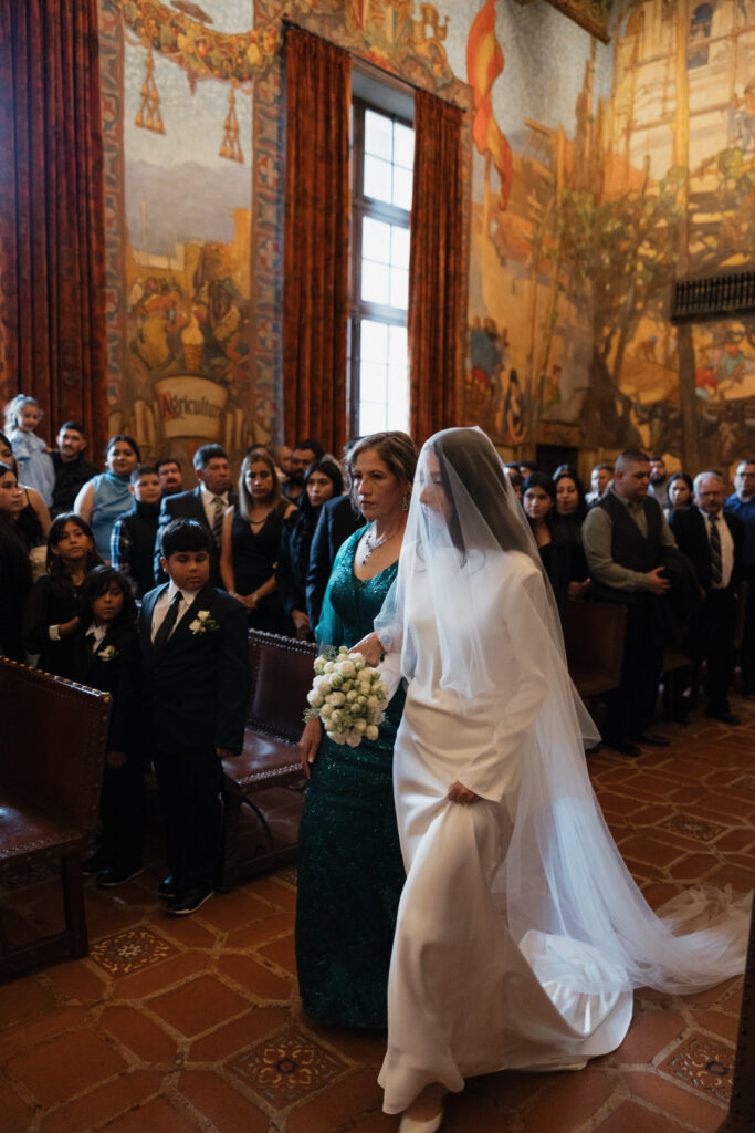 Bride walking down the aisle at the Santa Barbara Courthouse.
