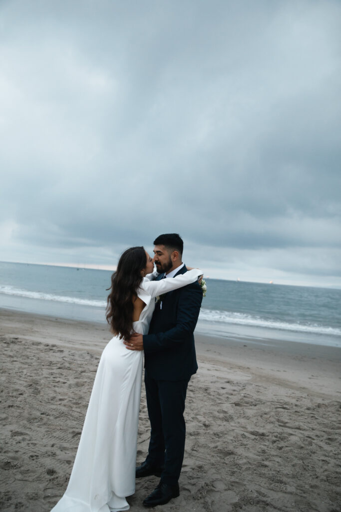 Newlyweds celebrating at the end of their wedding day.