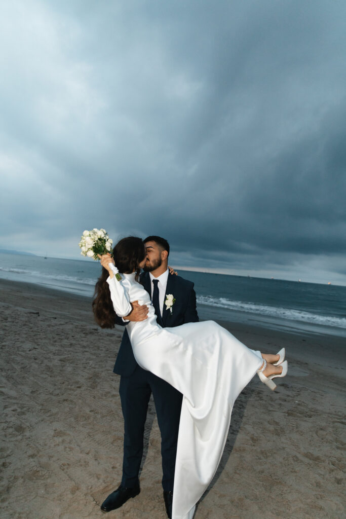 Newlyweds celebrating at the end of their wedding day.