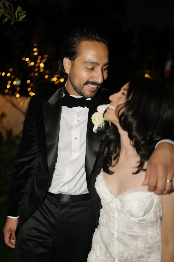 Bride and groom celebrating with loved ones.